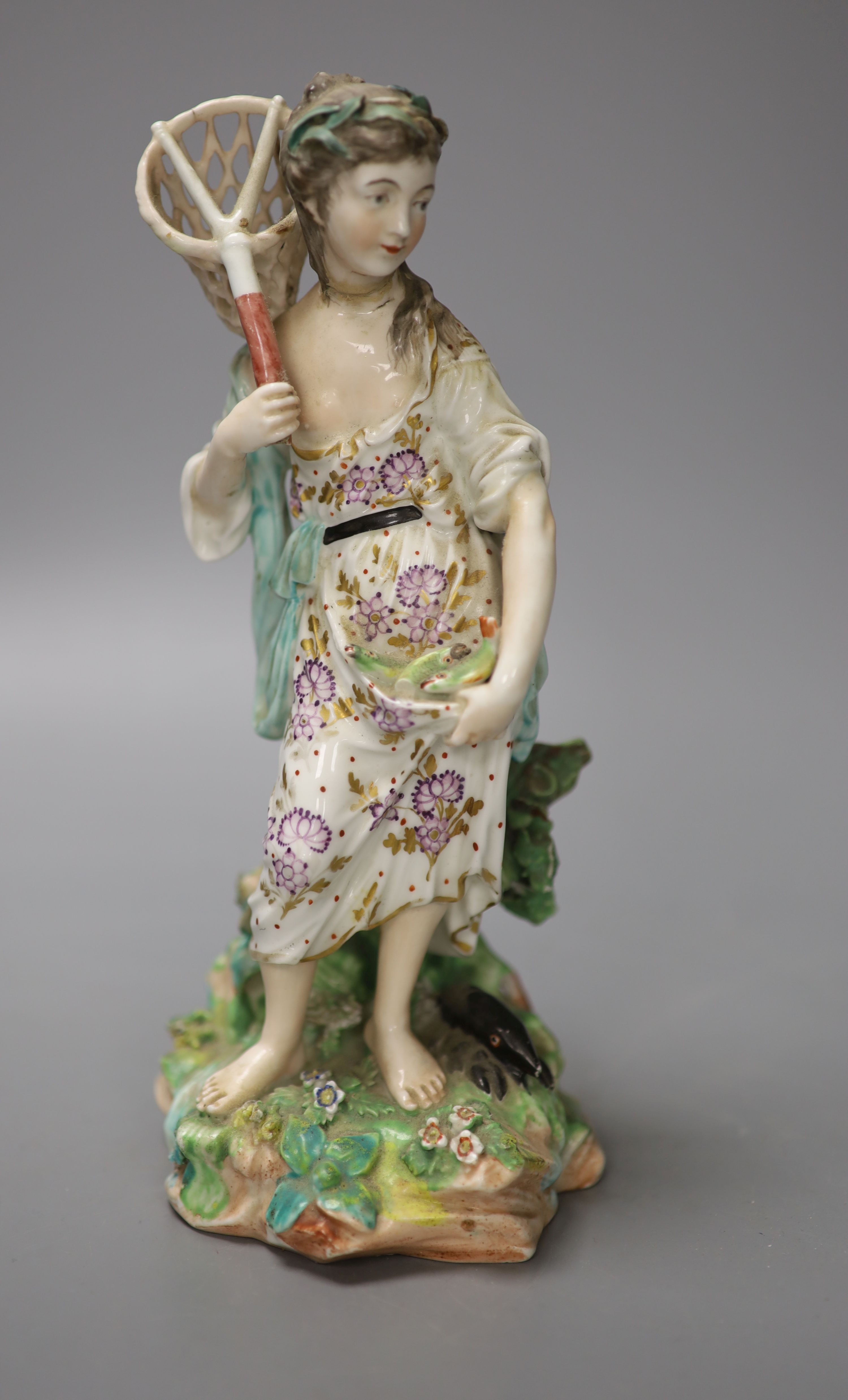 A Derby figure of Water, modelled as a girl holding a fish net her apron holding three fish, stand on a naturalistic beside a black lob